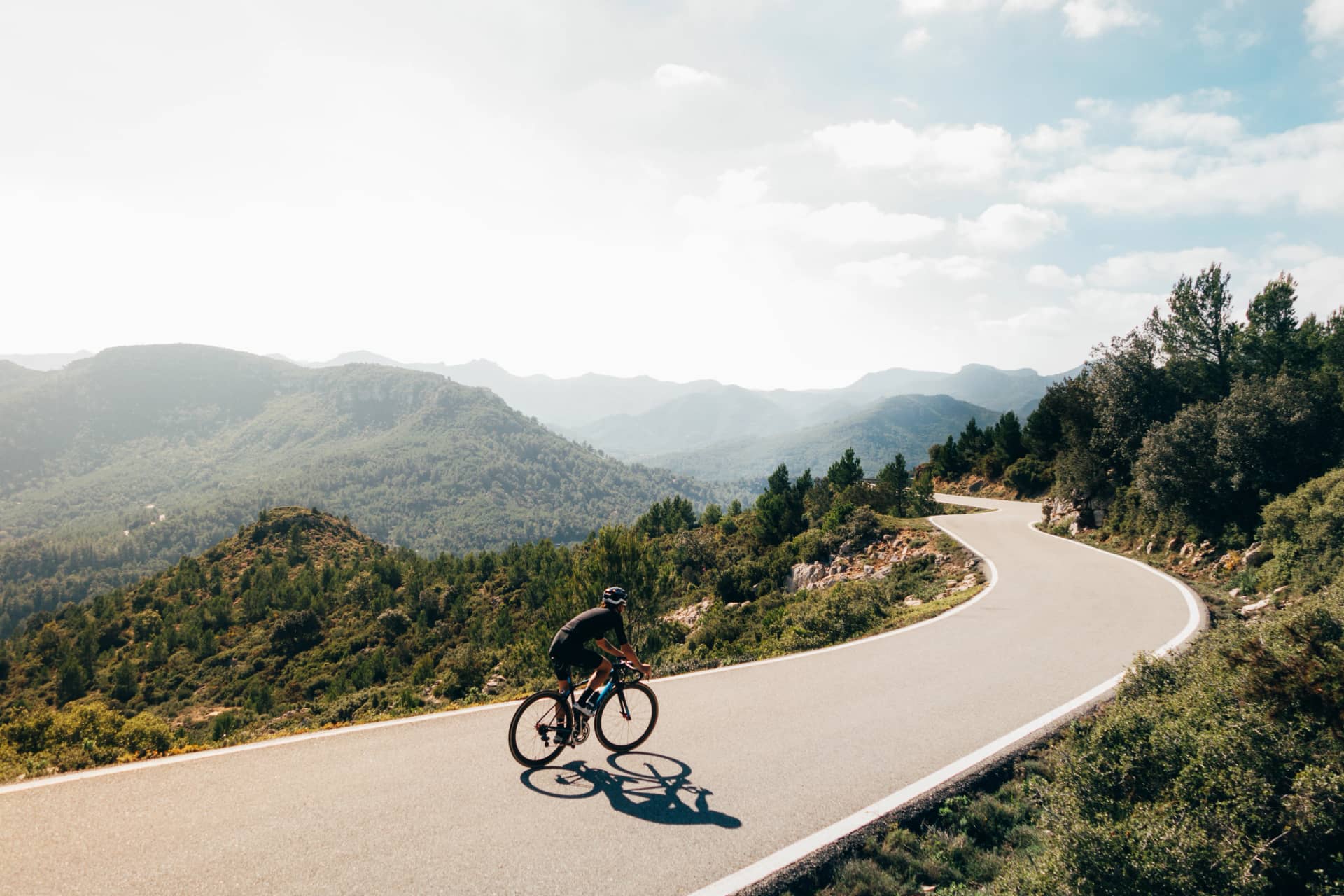 Cyclist on a catalonian mountain road