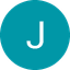 White capital letter J inside a teal circle against a black background.