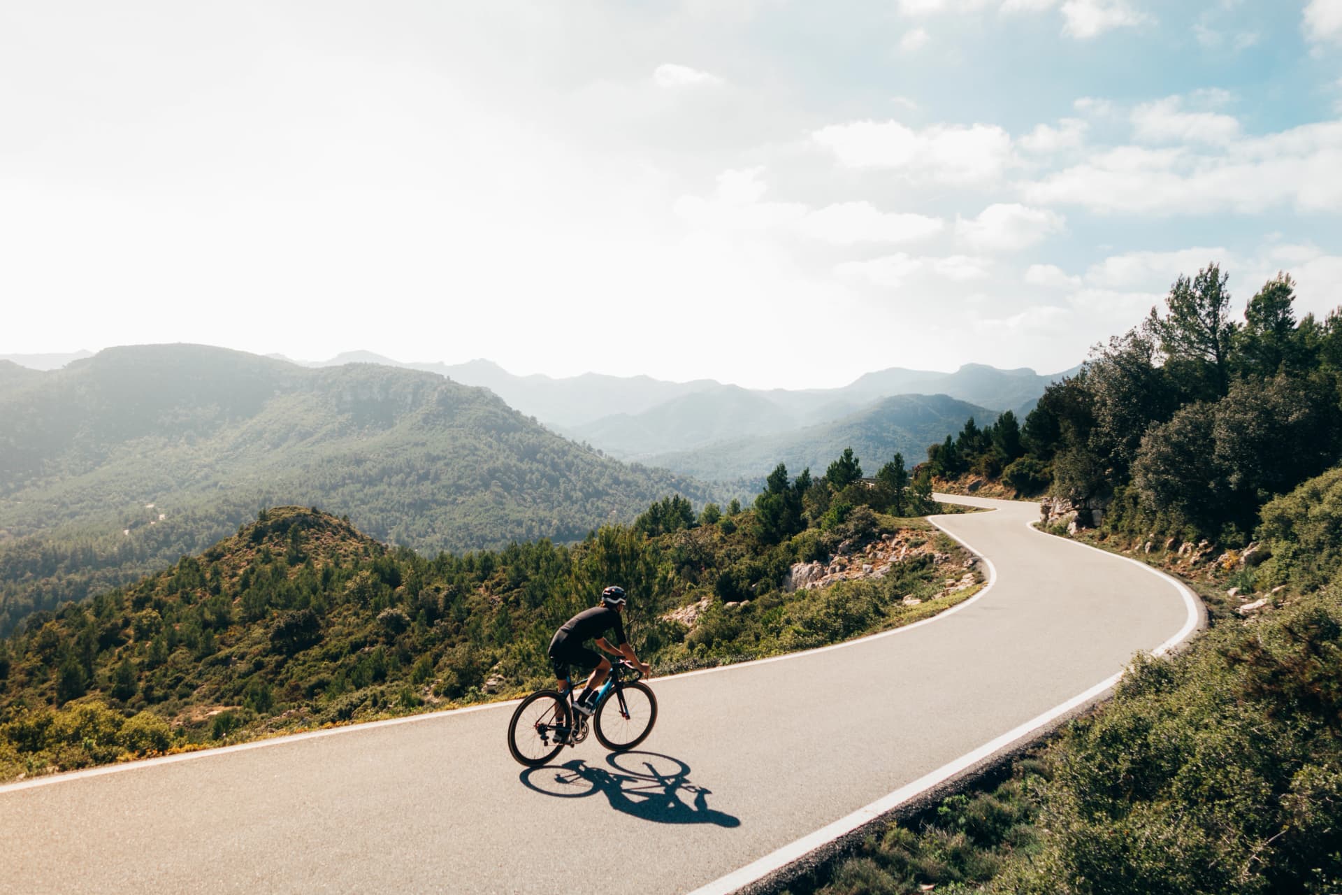 Cyclist on a catalonian mountain road