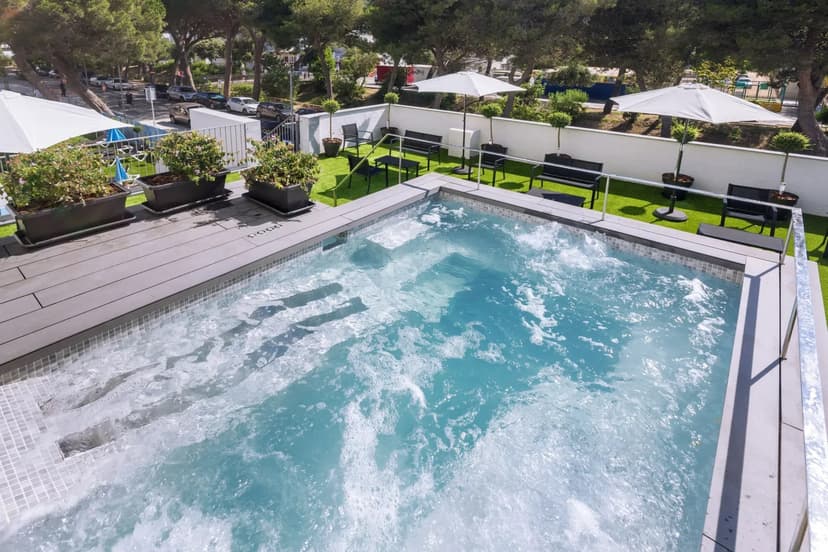 Hot tub on the terrace at Hotel GHT Sa Riera