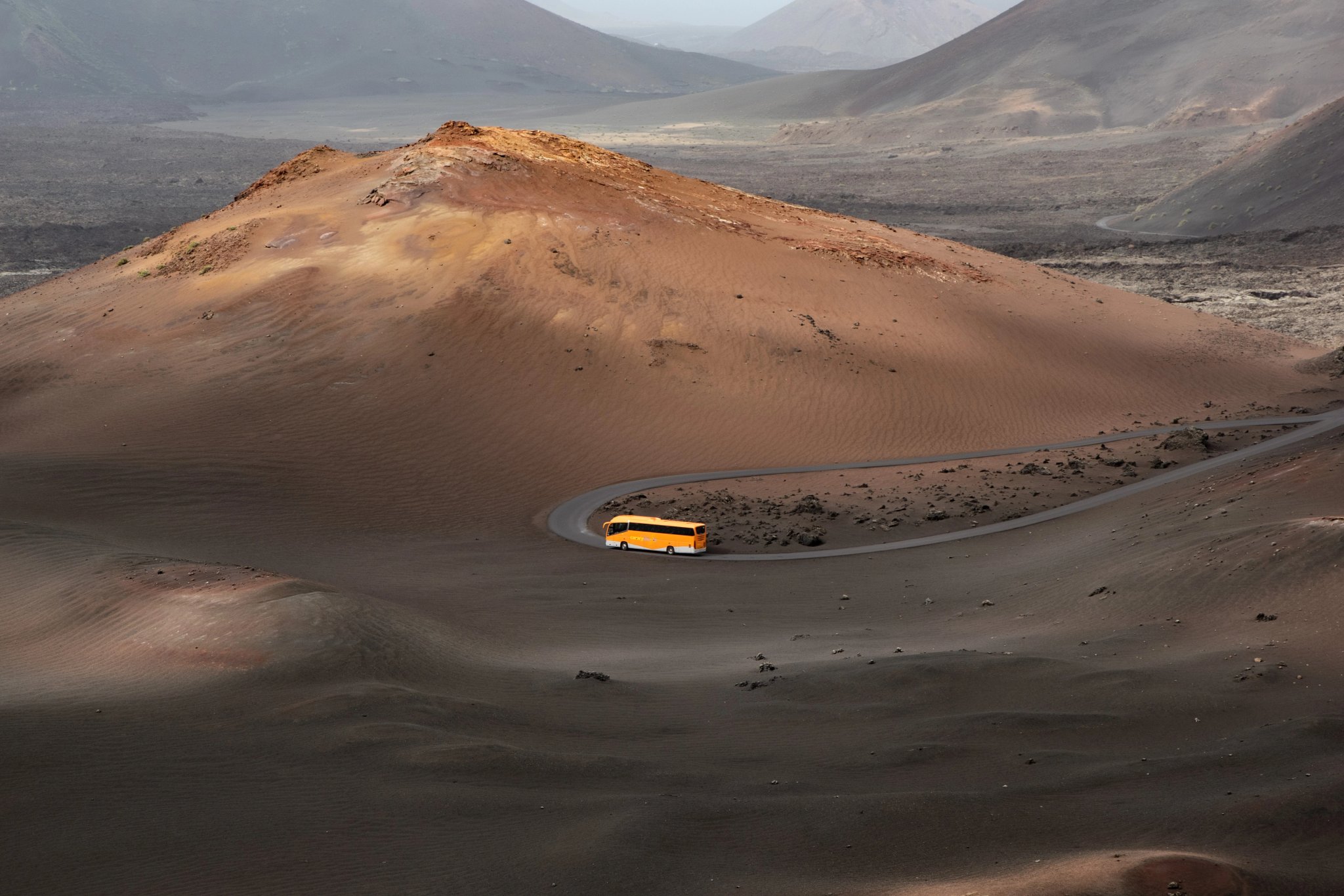 A bus crossing Timanfaya national park on Lanzarote