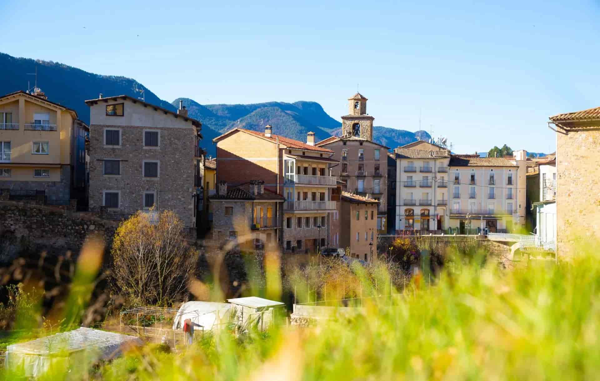 view of cityscape with river in La Pobla de Lillet in Spain..