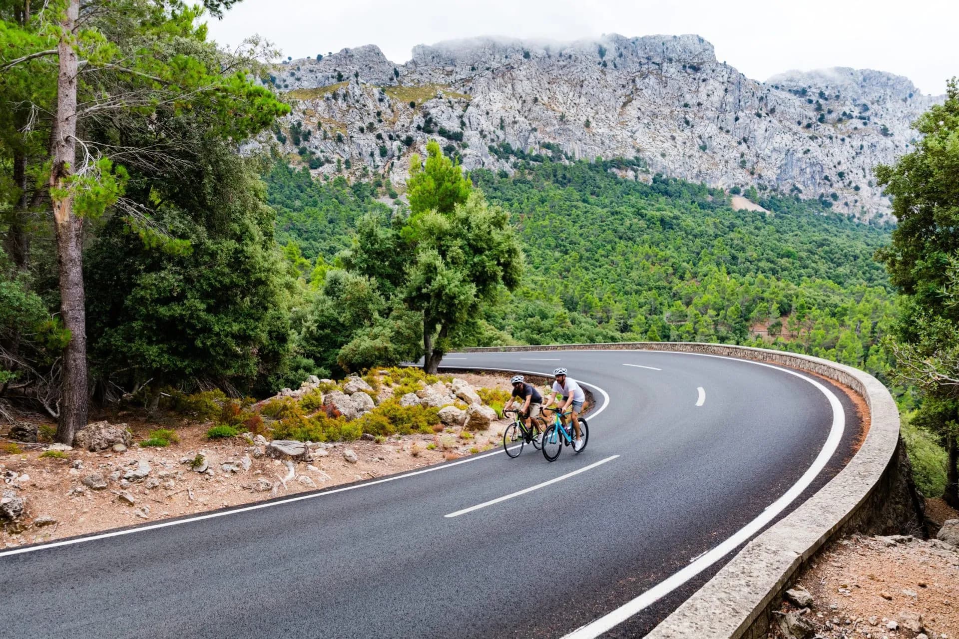 Cyclists riding up the Puig Major peak in Majorca