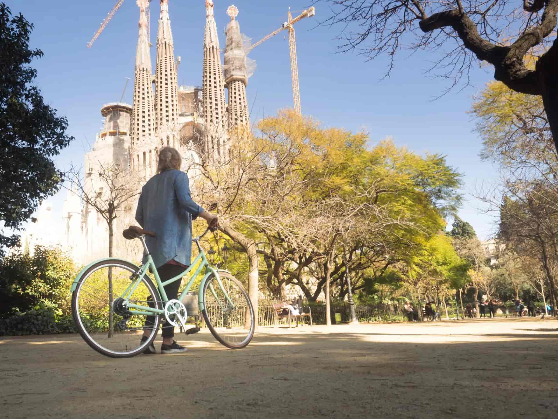 woman cycling sagrada familia