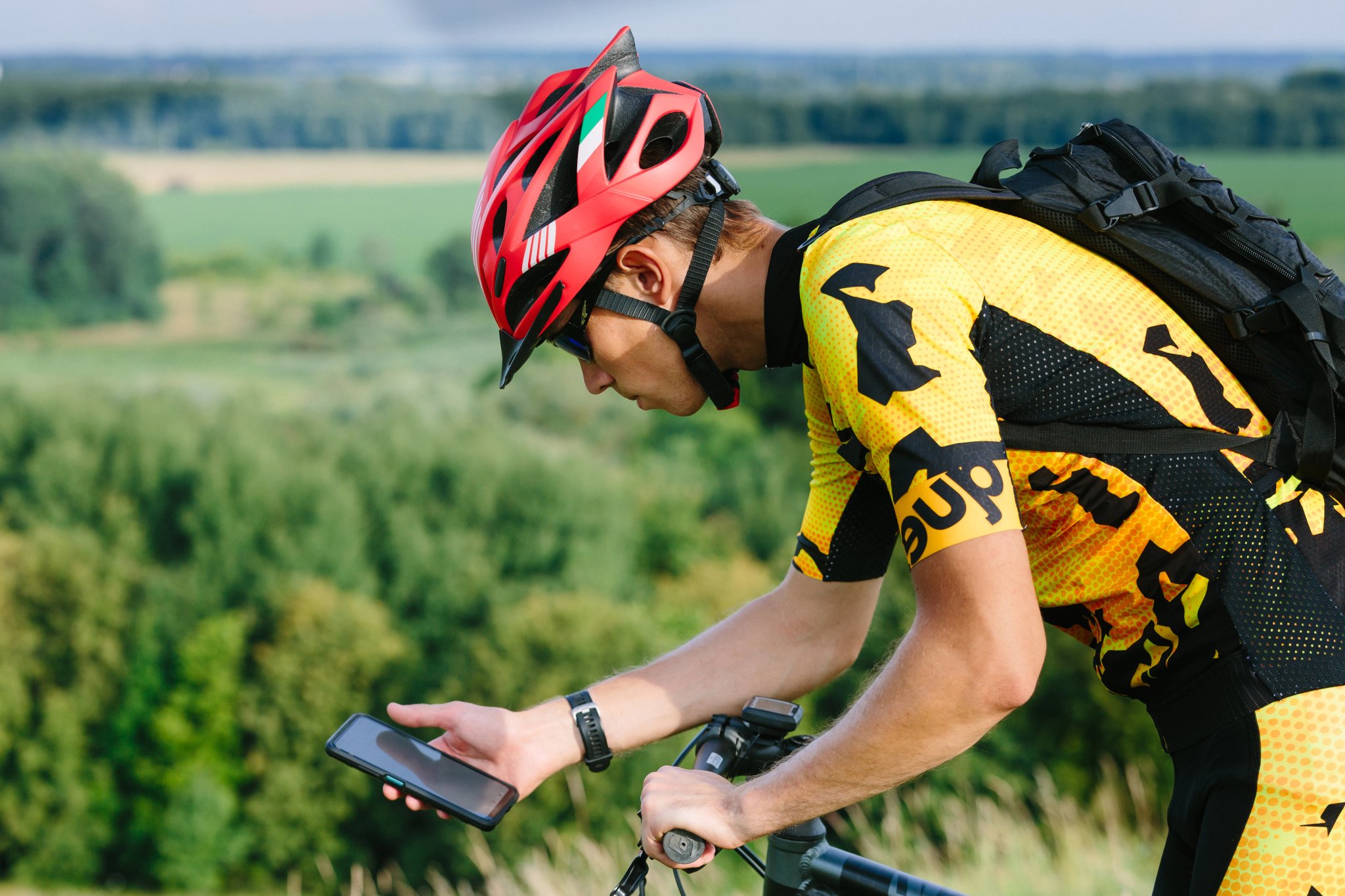 Cyclist man holding screen