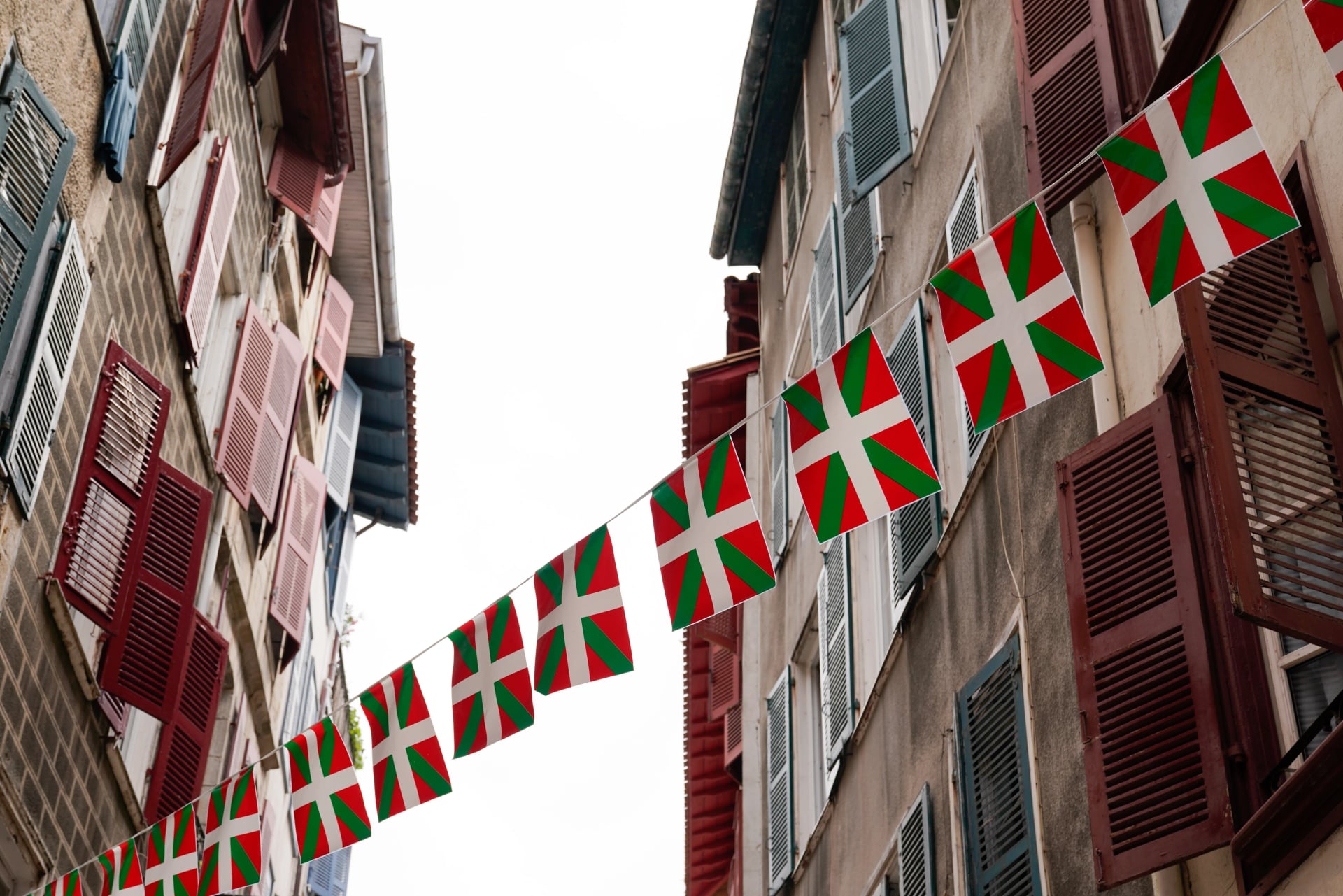 Traditional architecture basque street building house with flag bask country in france