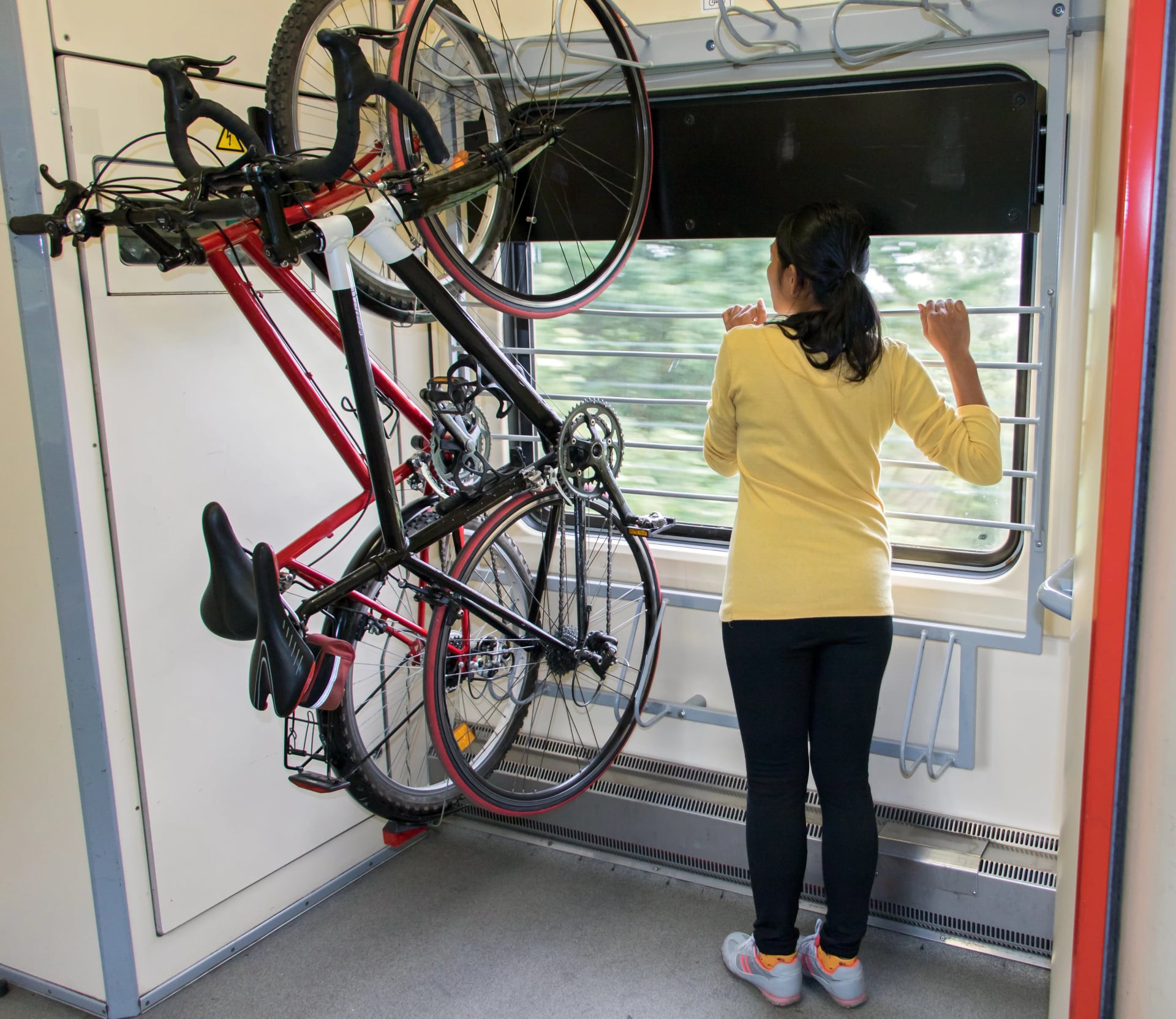 Bike hanging on the rack in the train