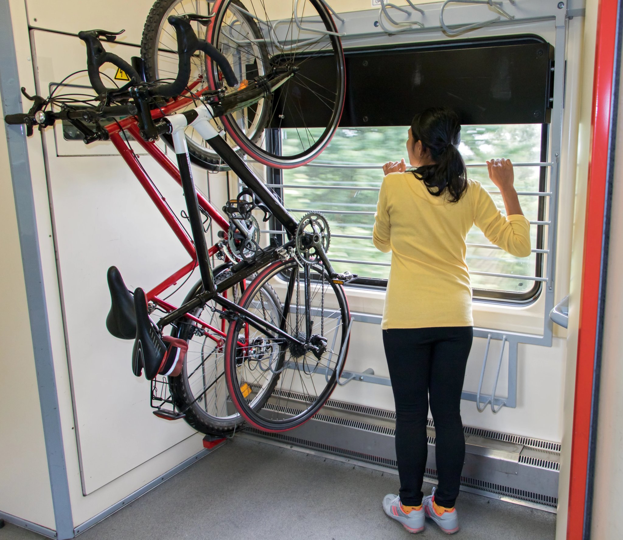 Bike hanging on the rack in the train