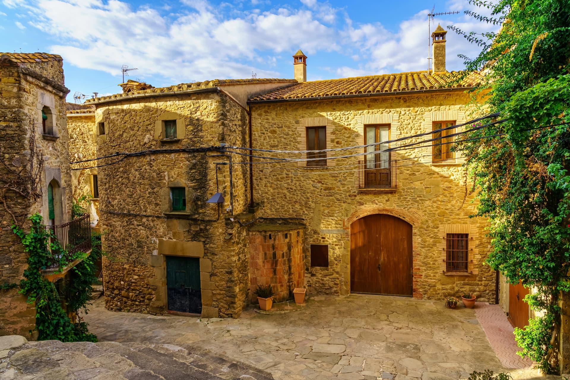 Idyllic stone buildings in the medieval village of Madremanya, Catalonia.